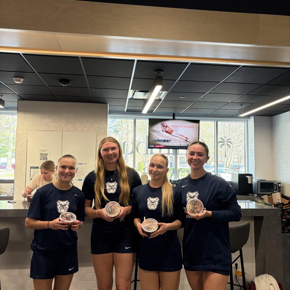 Four Butler athletes holding Chimba bowls